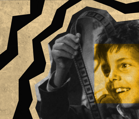 a child looking and smiling at a film strip