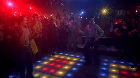 man dancing on the dance floor while people are watching