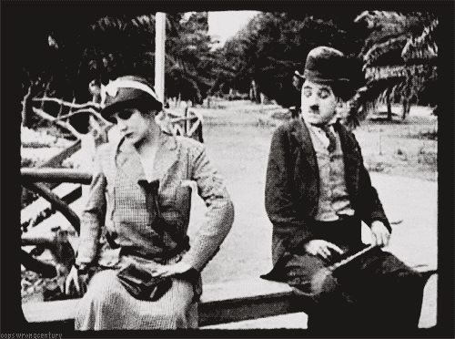 man sitting closer by a woman