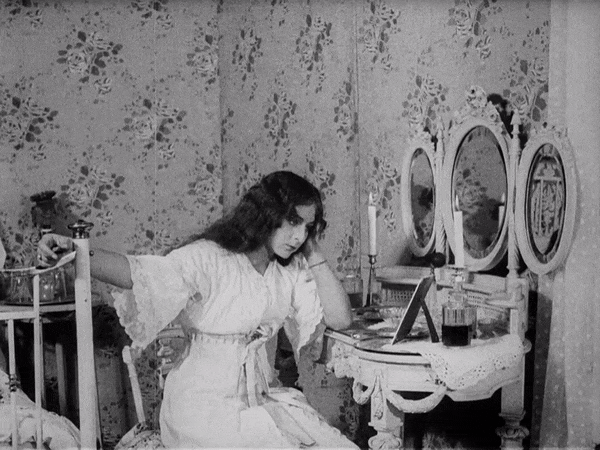 Woman looking at photo of man